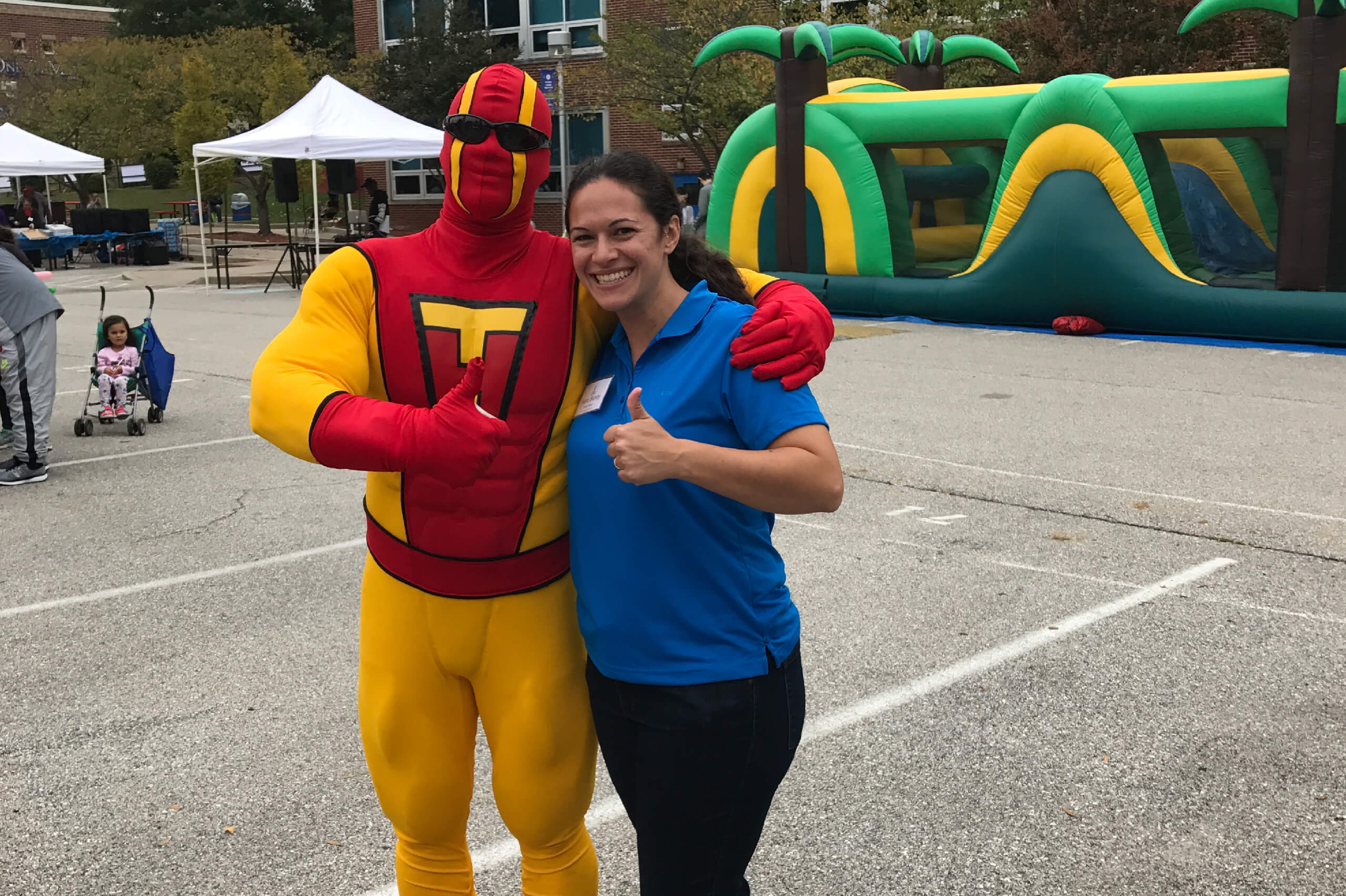 TurboMan poses with an Ellicott City, Maryland residents during a bulk trash pickup and junk removal event.